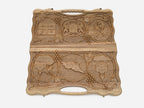 The carry handle and upper vine carving