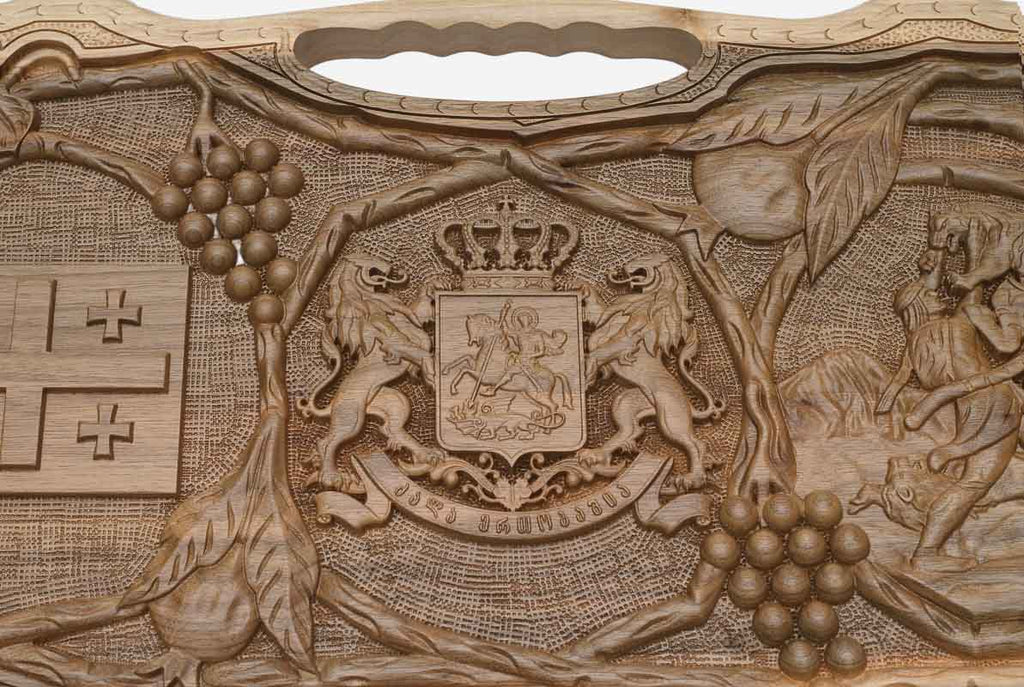 Detail of the carved grapevines around the emblems