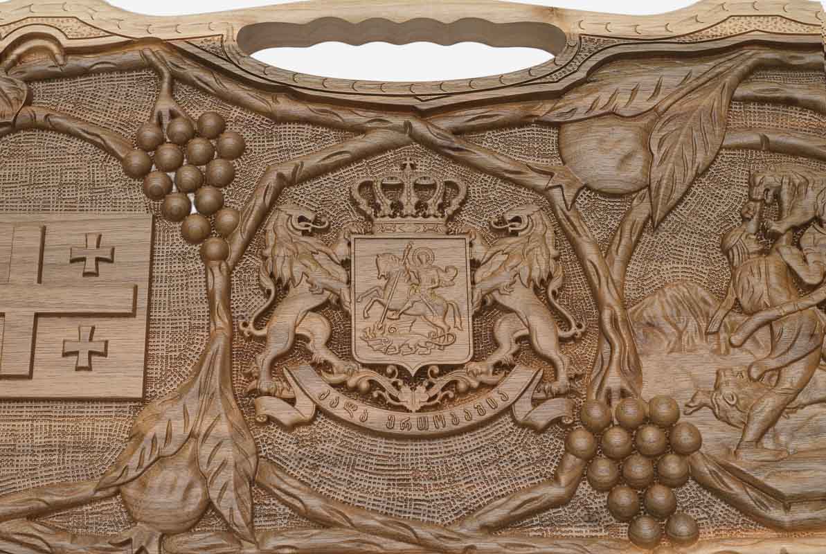 Detail of the carved grapevines around the emblems