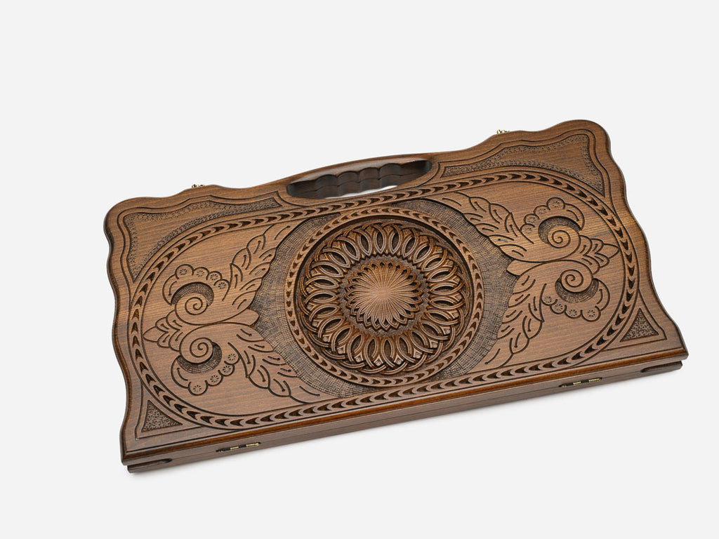 Angled view of the ornamental carved backgammon board