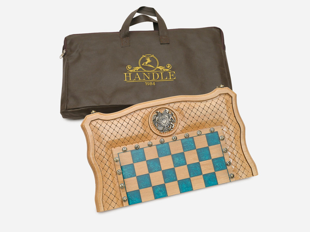 The turquoise epoxy chess set shown closed with its coat-of-arms emblem
