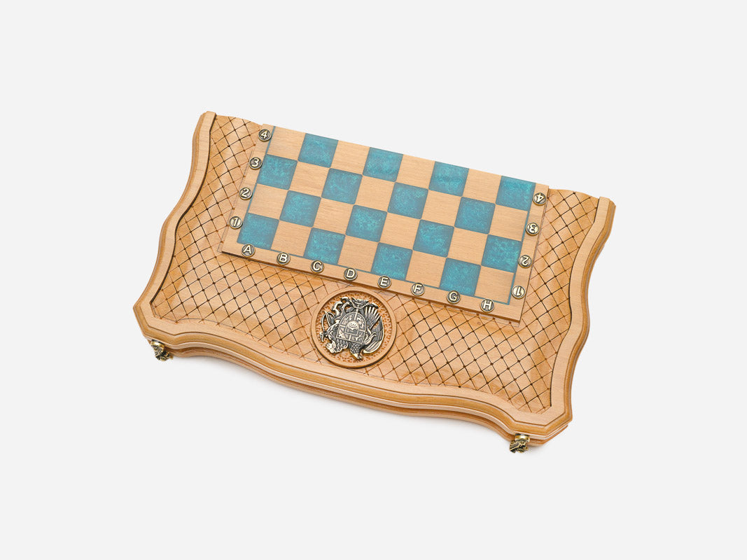 Angled view of the epoxy chess set with its coat-of-arms medallion
