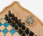 Close-up of the dark wooden pieces beside the inlaid coat-of-arms medallion