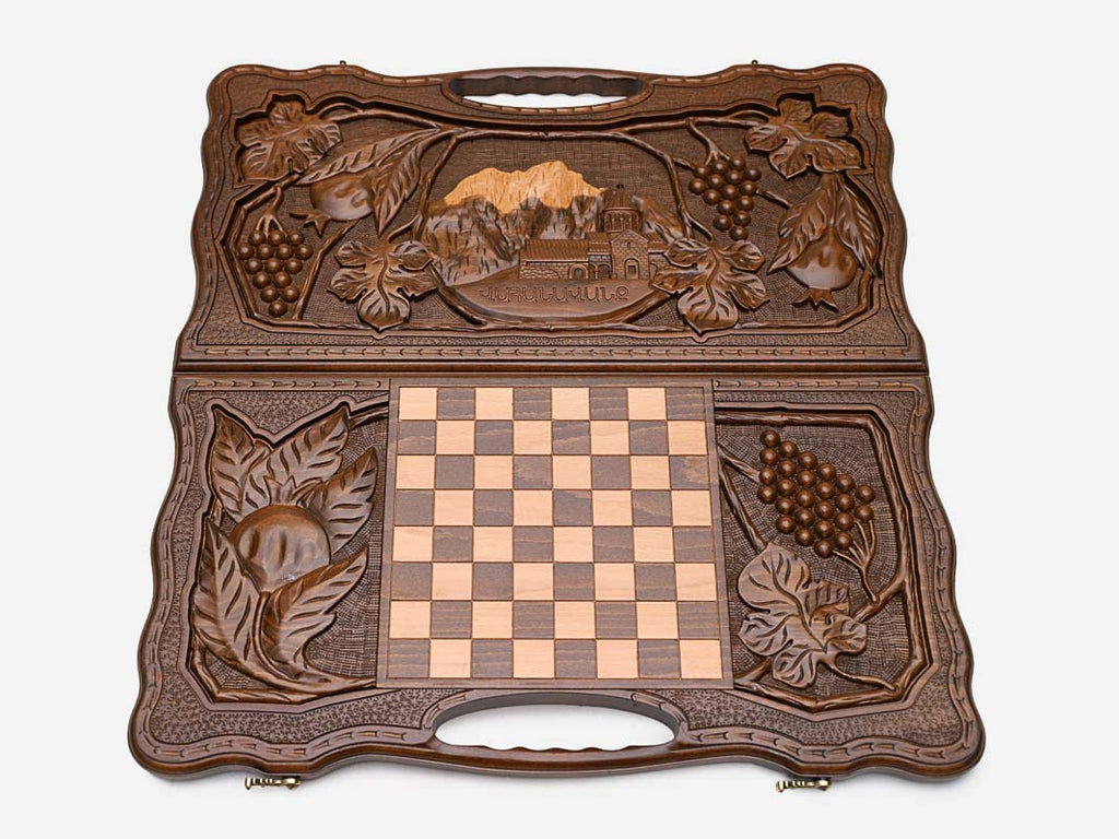 The carry handle and carved border of the board