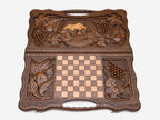 The carry handle and carved border of the board