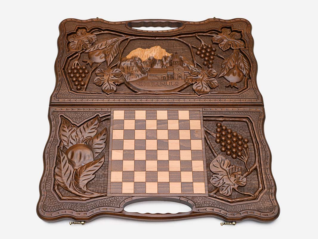 The carry handle and carved border of the board