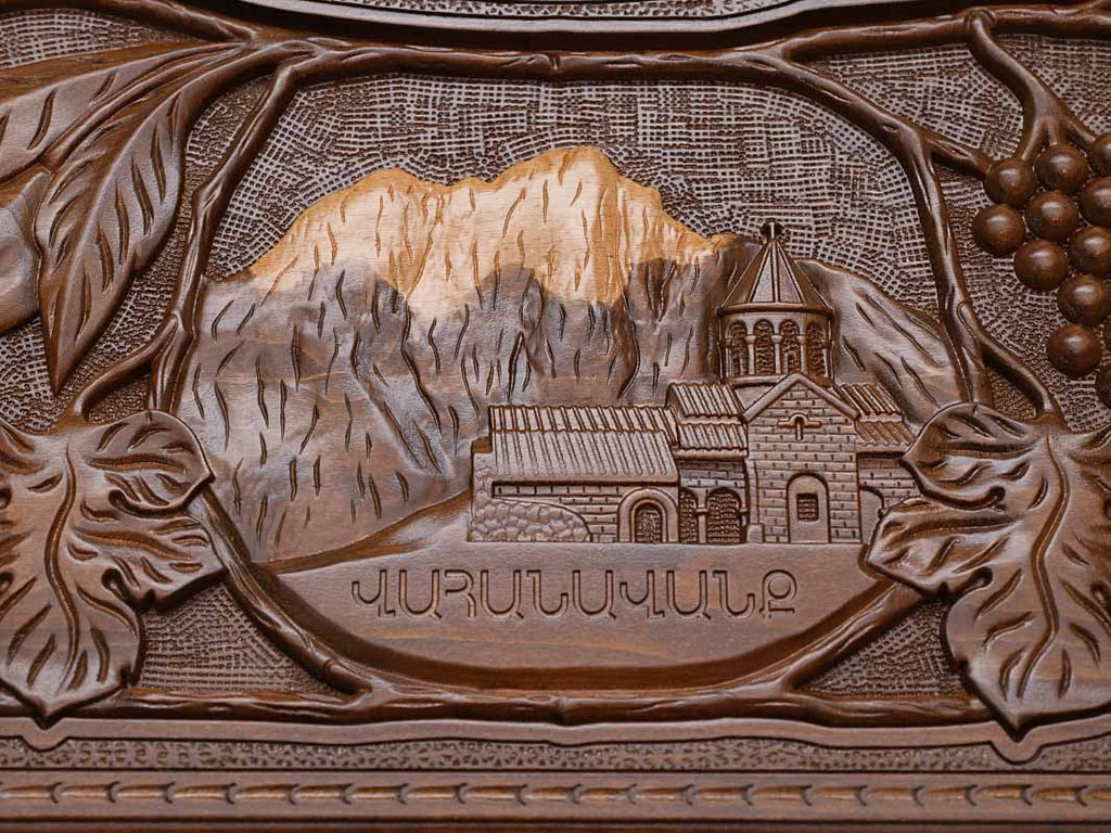 Close-up of the carved monastery and mountain scene