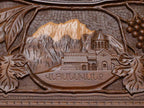 Close-up of the carved monastery and mountain scene