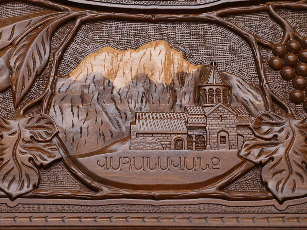 Close-up of the carved monastery and mountain scene
