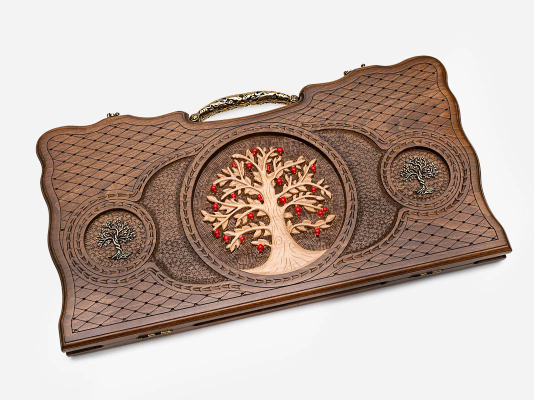 Angled view of the bronze tree of life carved backgammon board