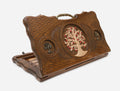 Carved beechwood backgammon board with a bronze tree of life medallion and ornate bronze carry handle, shown propped open