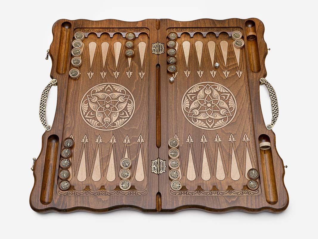 The backgammon board opened to reveal the wooden playing points