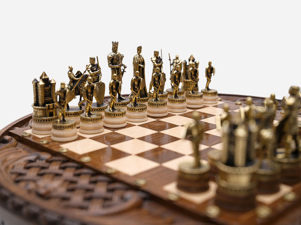 Close-up of the castle rook and royal figures on the Chess Royal Circle board