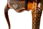 Basket-weave carved leg panel of the game table