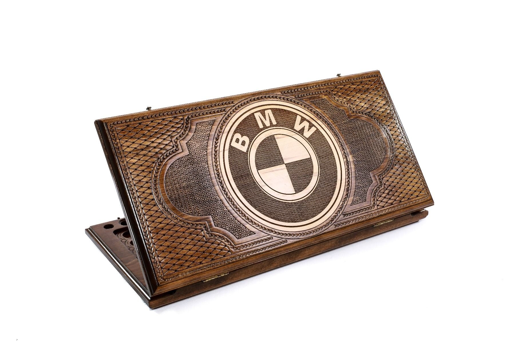 A frontal shot of the closed BMW classic backgammon board featuring the hand-carved circular logo.