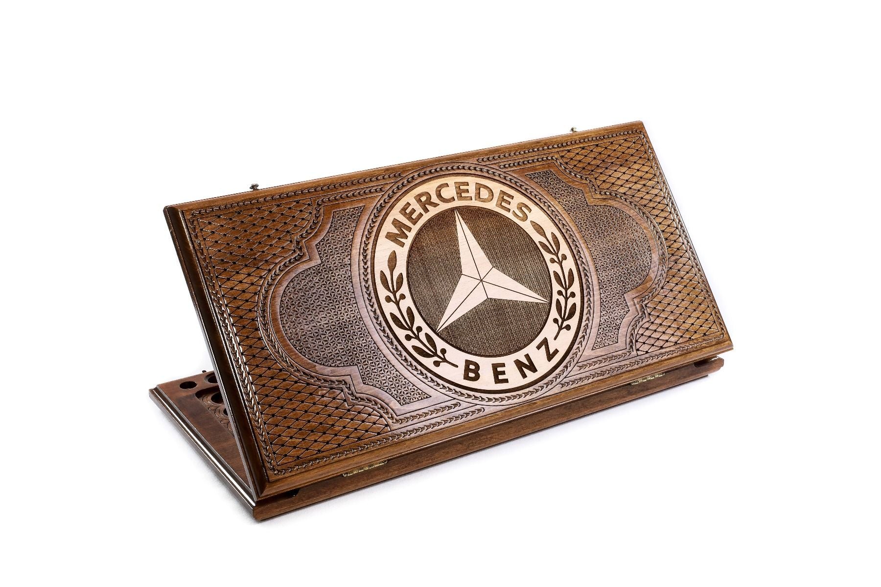 A frontal shot of the closed Mercedes-Benz classic backgammon board featuring the hand-carved three-pointed star.