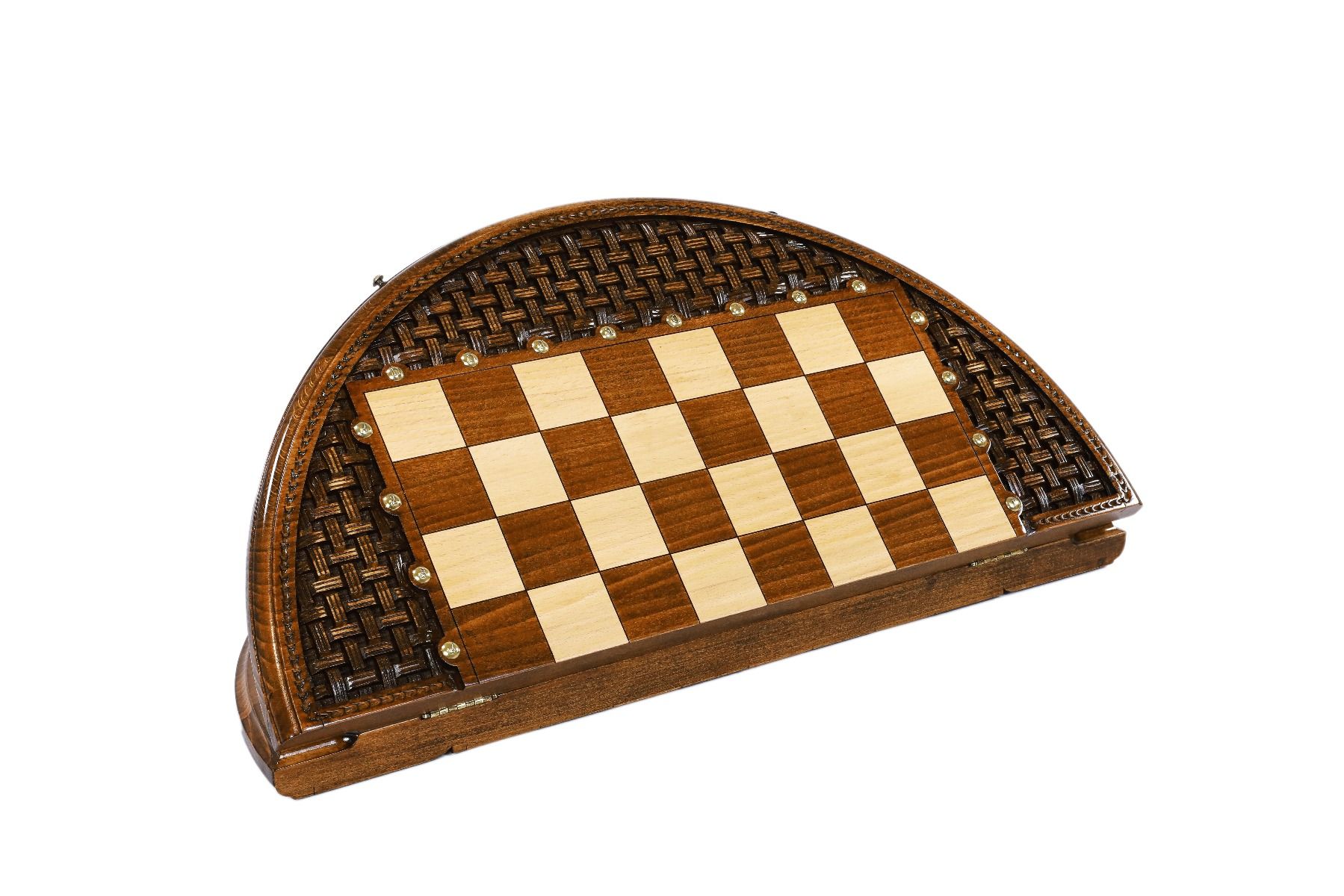 Artistic circular chess set with carved details on a wooden board.
