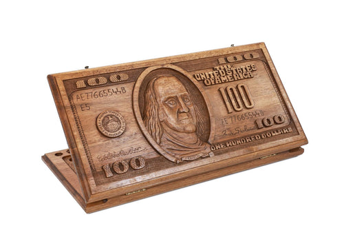 A frontal shot of the closed 100 dollar bill classic backgammon board showing the detailed wood incrustation and carving.

