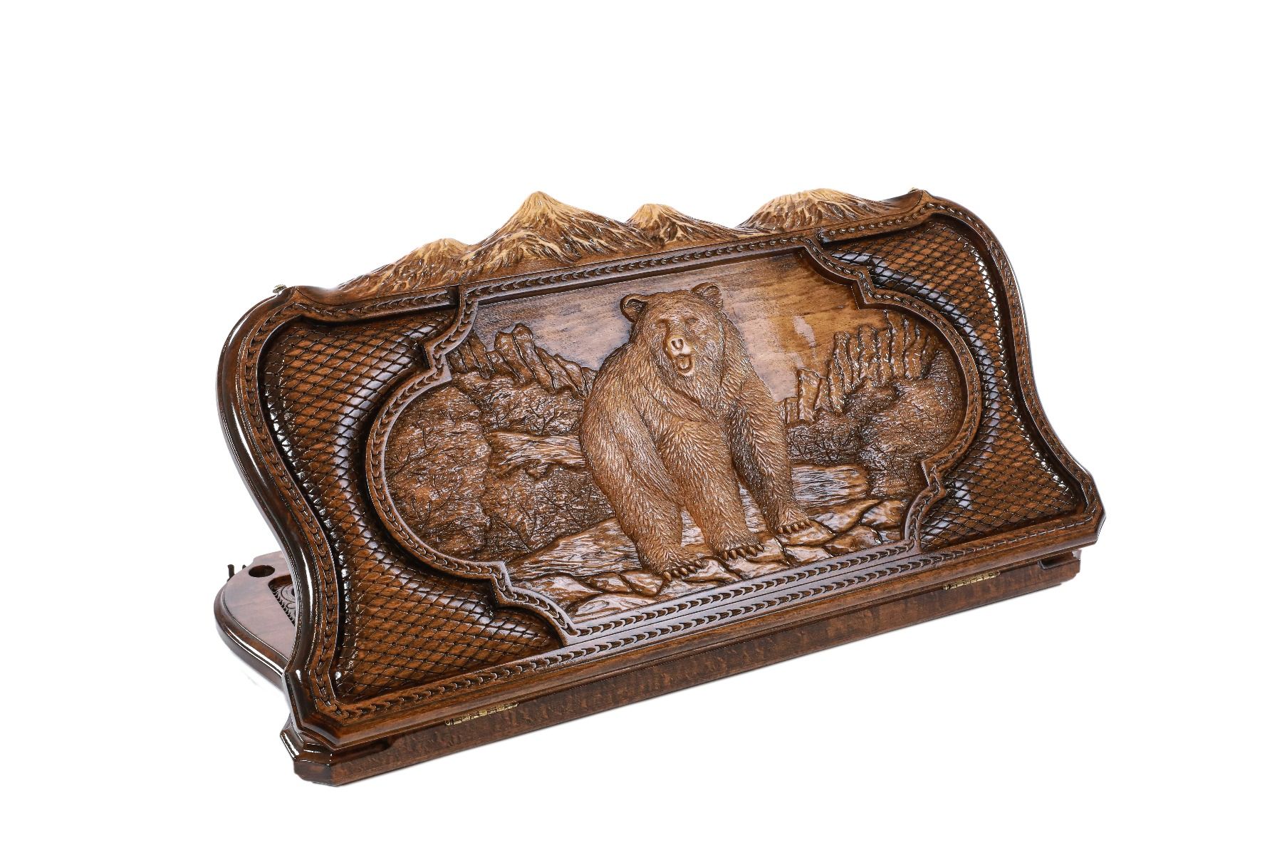 A frontal shot of the closed Bear and Deer backgammon board showing the mountain contour and high-relief bear carving.
