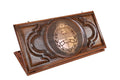 A frontal shot of the closed Argentina Coat of Arms backgammon board showing the detailed Sun of May and laurel relief.
