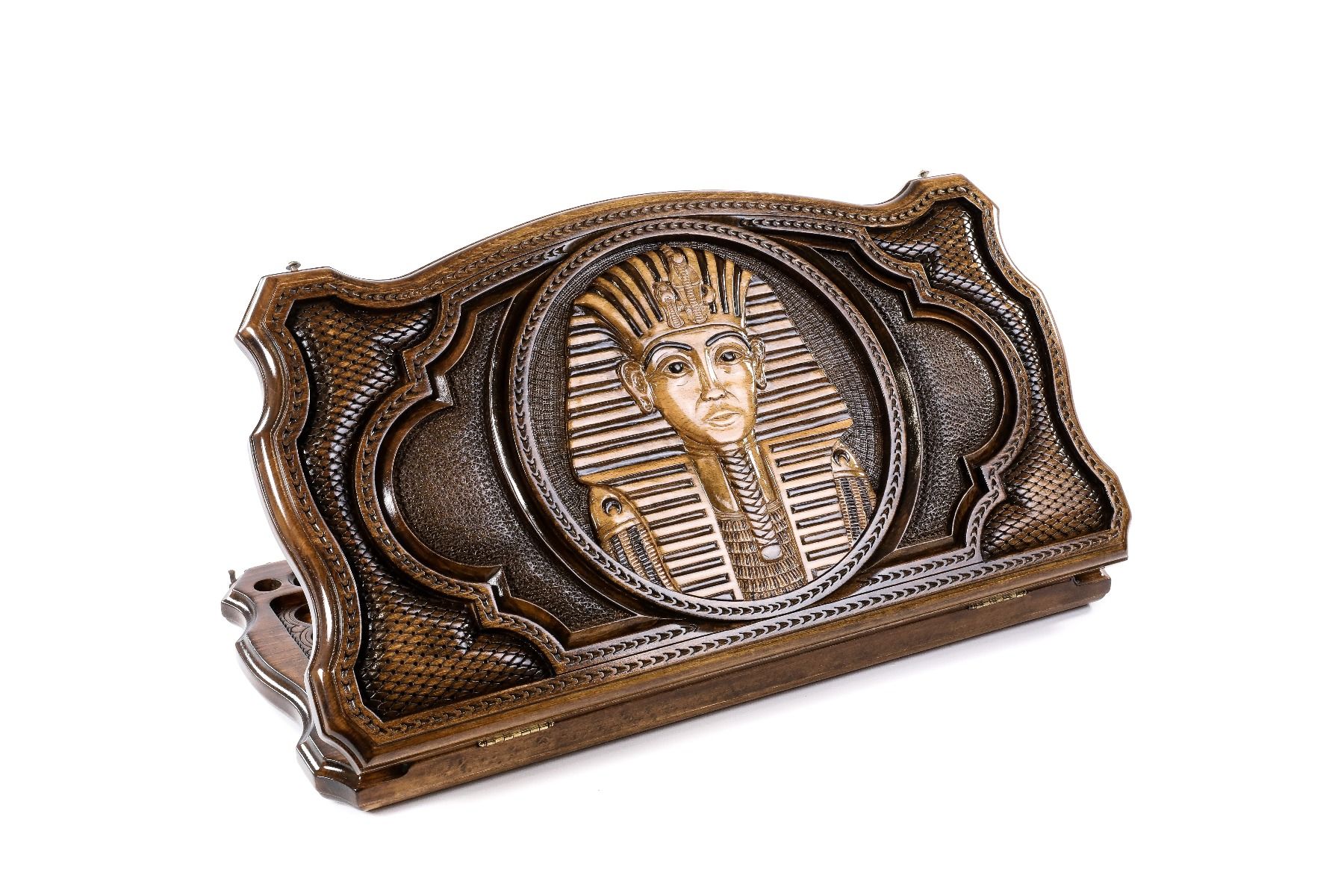 A frontal shot of the closed Tutankhamun backgammon board showing the detailed Pharaoh mask relief and the unique copyrighted contour edges.

