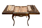 Wooden chess table set up with hand-carved chess pieces