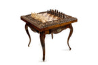 Hand-carved chess pieces arranged on the board