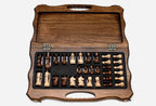 Overhead view of the chessboard and the full set of pieces