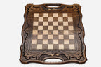 Close-up of the beech and walnut chess pieces on the inlaid squares