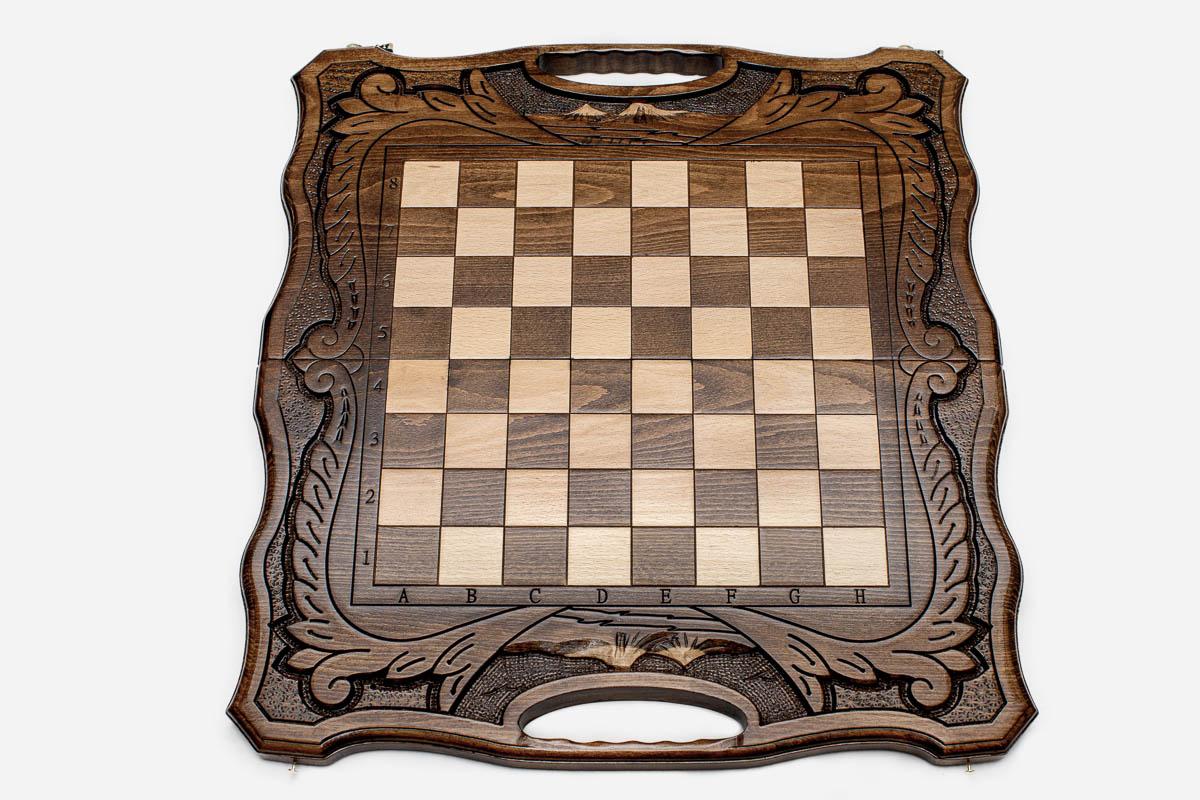 Close-up of the beech and walnut chess pieces on the inlaid squares