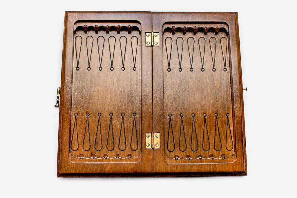 Classic chess and backgammon set shown folded with carry handle