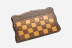 Classic chess and backgammon set shown folded with carry handle