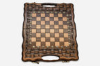 Close-up of a lattice design carving on the beech board