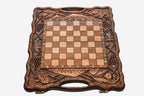 Angled view of the pomegranate and grape chess set with its wooden pieces