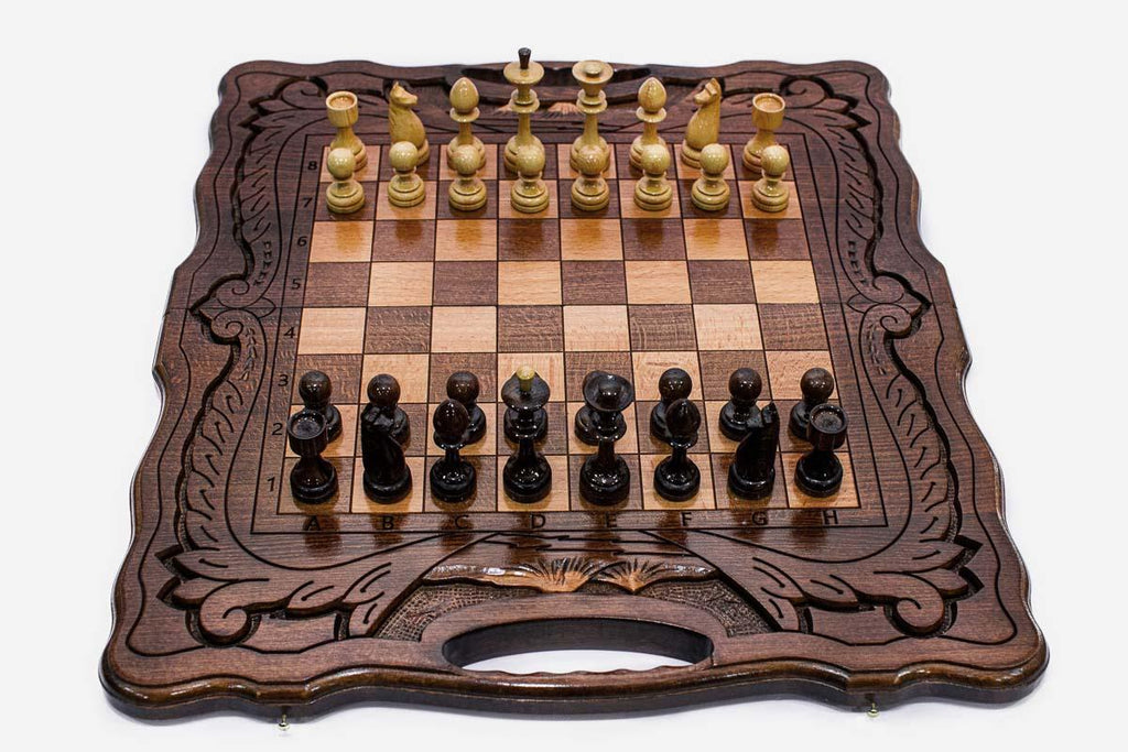 Folding walnut chess board with a Mount Ararat inlay, carved corners and beech and walnut pieces in starting position