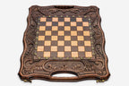Angled view of the carved chess-backgammon set with its bronze pieces