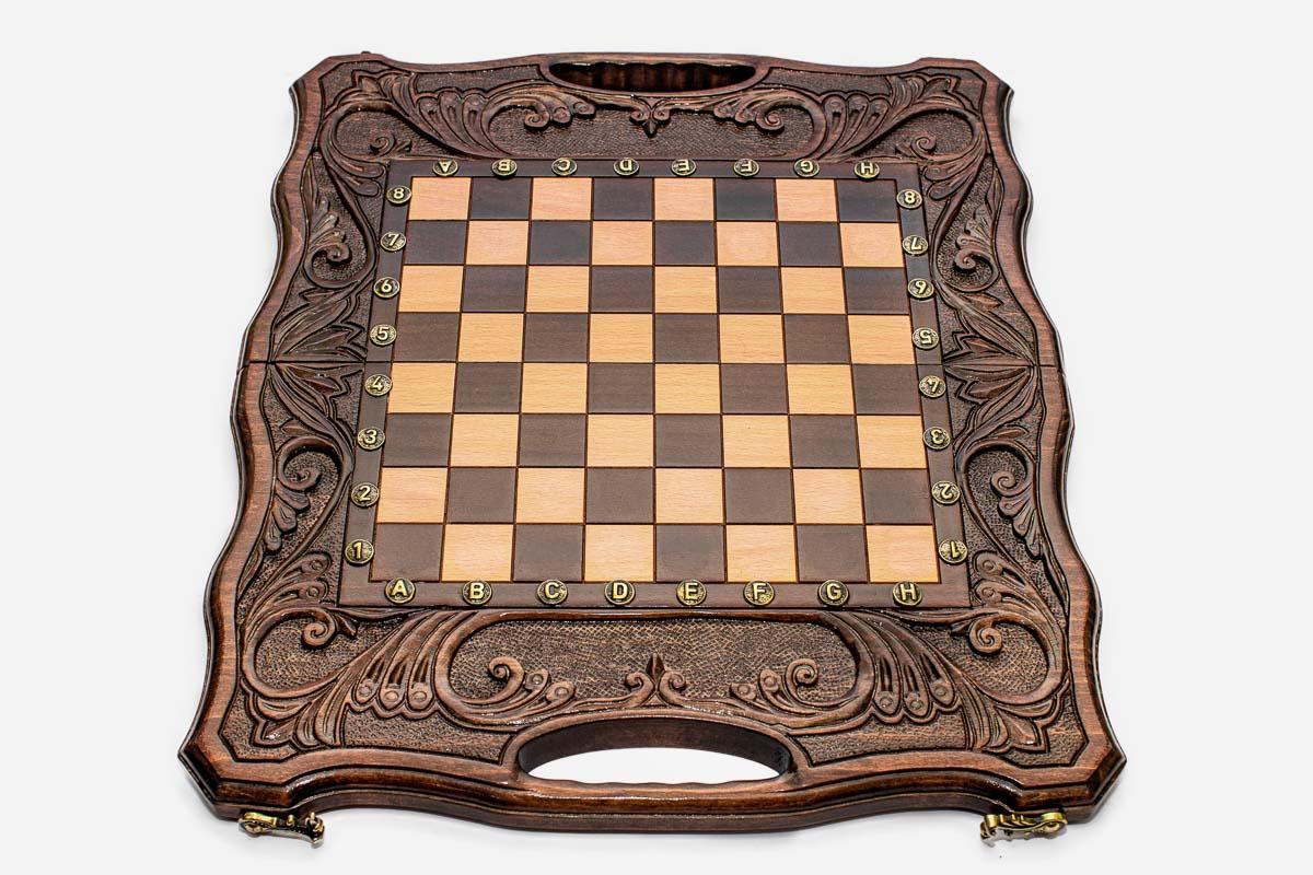 Angled view of the carved chess-backgammon set with its bronze pieces
