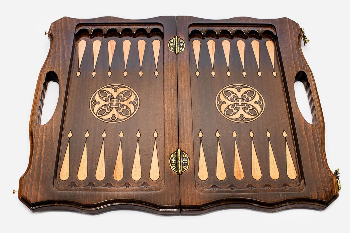 Detail of the deeply carved acanthus scrollwork on the board border