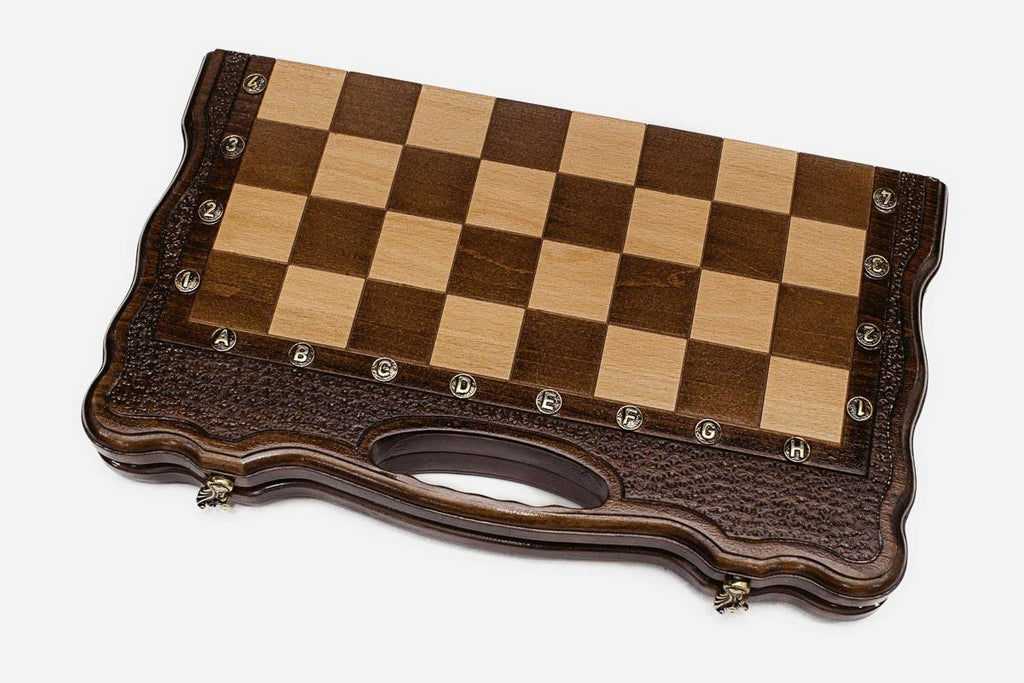 The folding chess board shown from an angle with its scalloped, textured frame