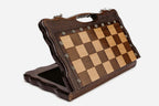 Overhead view of the chessboard with the full set of light and dark pieces