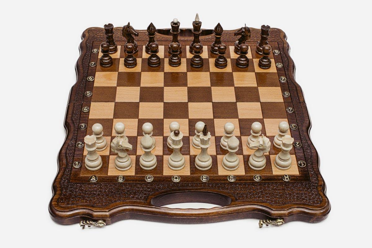 Close-up of the beech and walnut chess pieces on the inlaid squares