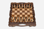 Folding walnut chess board with carved corners and ornate bronze figural pieces - dark and gold armies in starting position