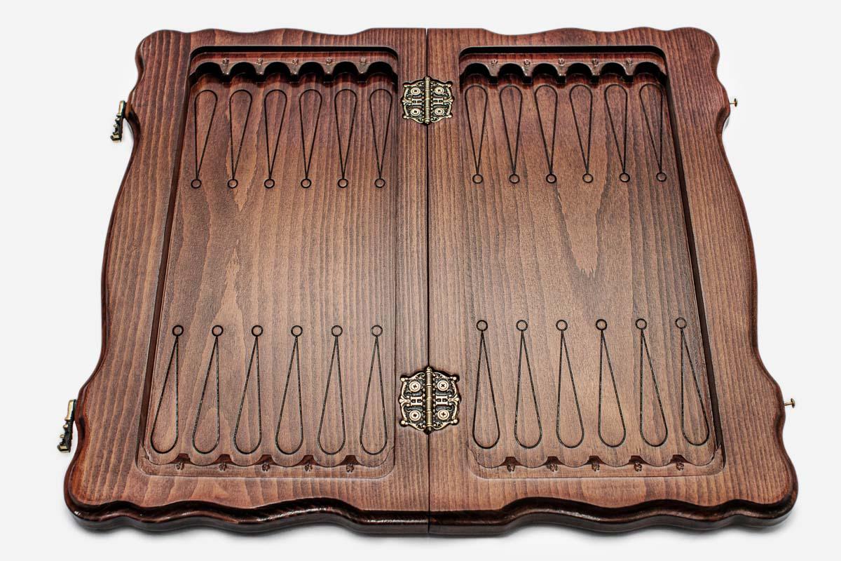 Close-up of a royal crown carving on the beech board