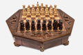 Octagonal wooden chess set with carved fleur-de-lis border and Staunton pieces set up on the inlaid board