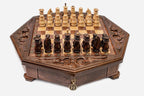 Octagonal wooden chess set with carved fleur-de-lis border and Staunton pieces set up on the inlaid board