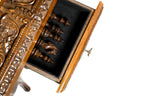 Ornate carved apron of the game table