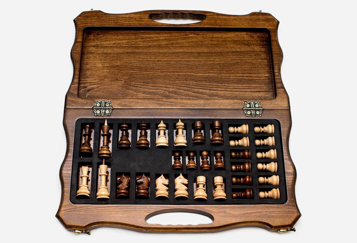 Overhead view of the chessboard and the full set of light and dark pieces