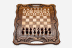 Folding walnut chess board with a Mount Ararat inlay, carved corners and beech and walnut pieces in starting position