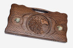Carved beechwood backgammon board with a bronze eagle medallion, propped open
