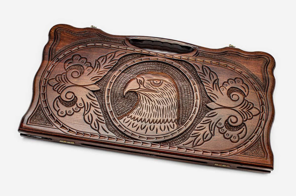 Carved beechwood backgammon board with a soaring eagle medallion and a carry handle, propped open
